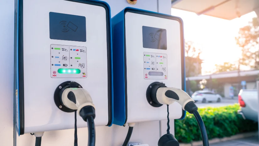 Commercial EV chargers installed with plugs in place outside