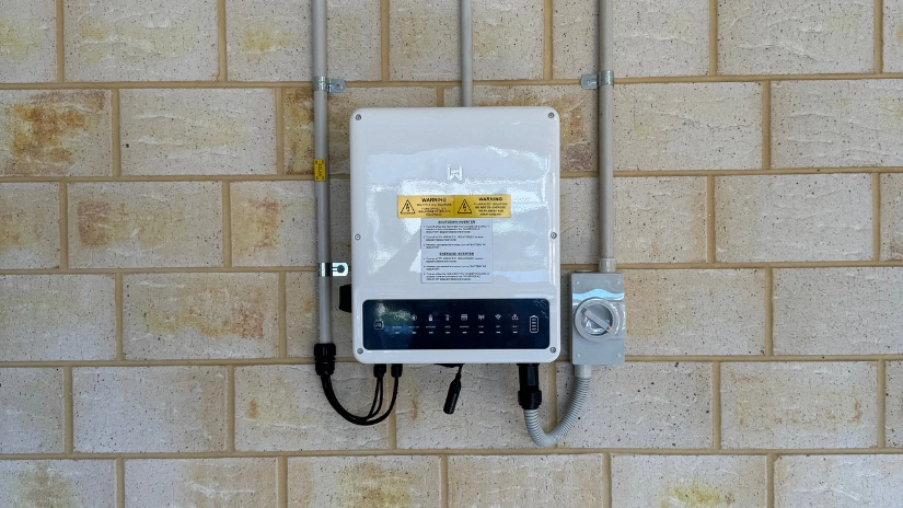 Neat Solar Inverters installation on brick garage wall by COYCO Rockingham